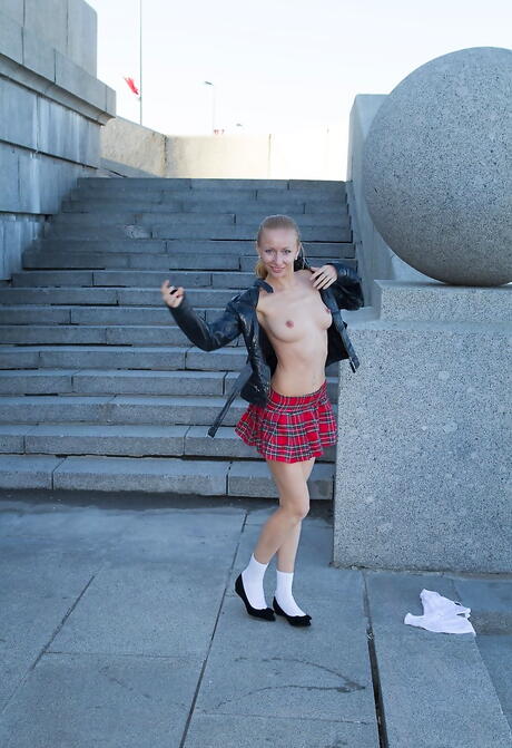 Sultry blonde Lisa T in sexy skirt showing her butt and hairy pussy outside